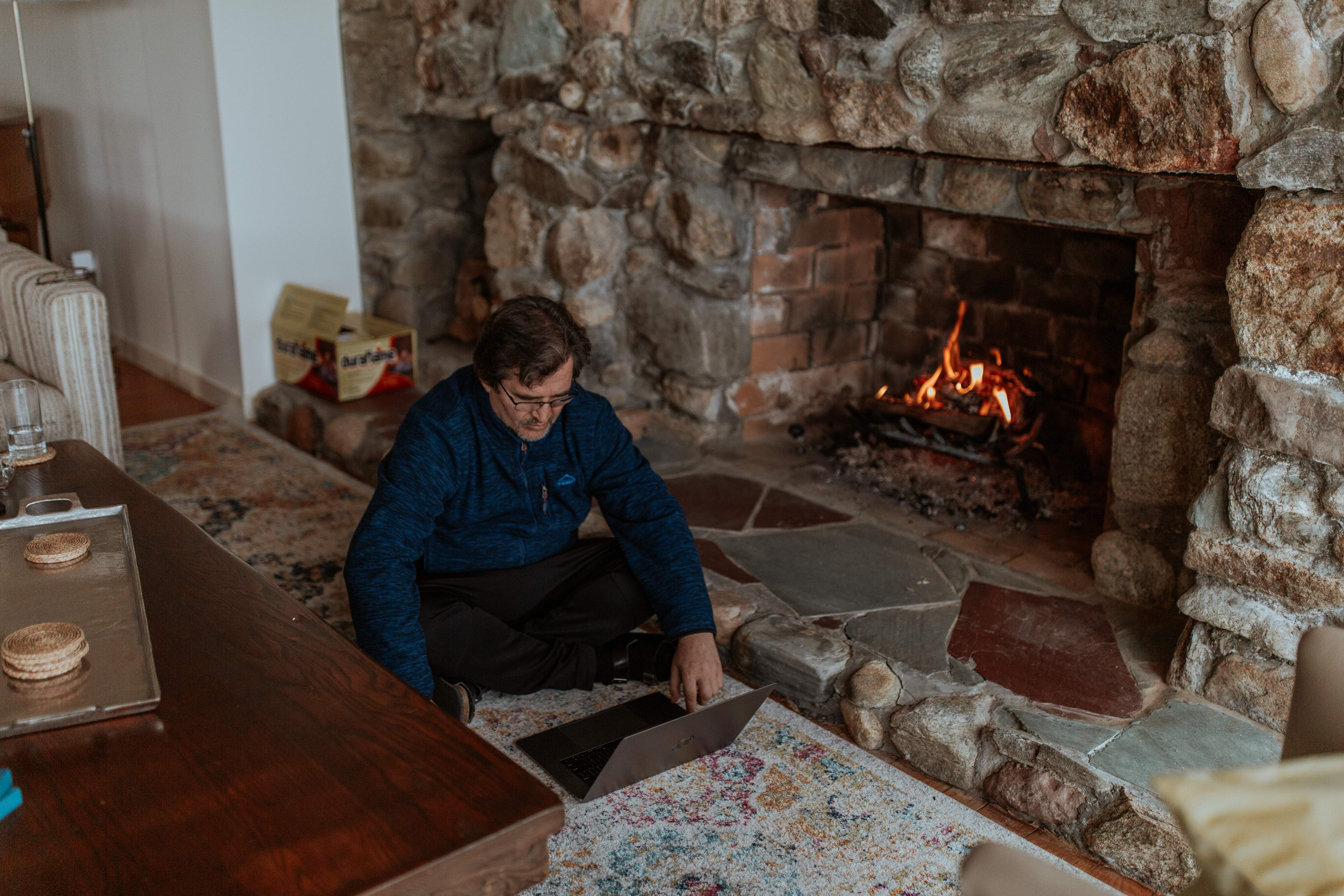 Milan working by the fire